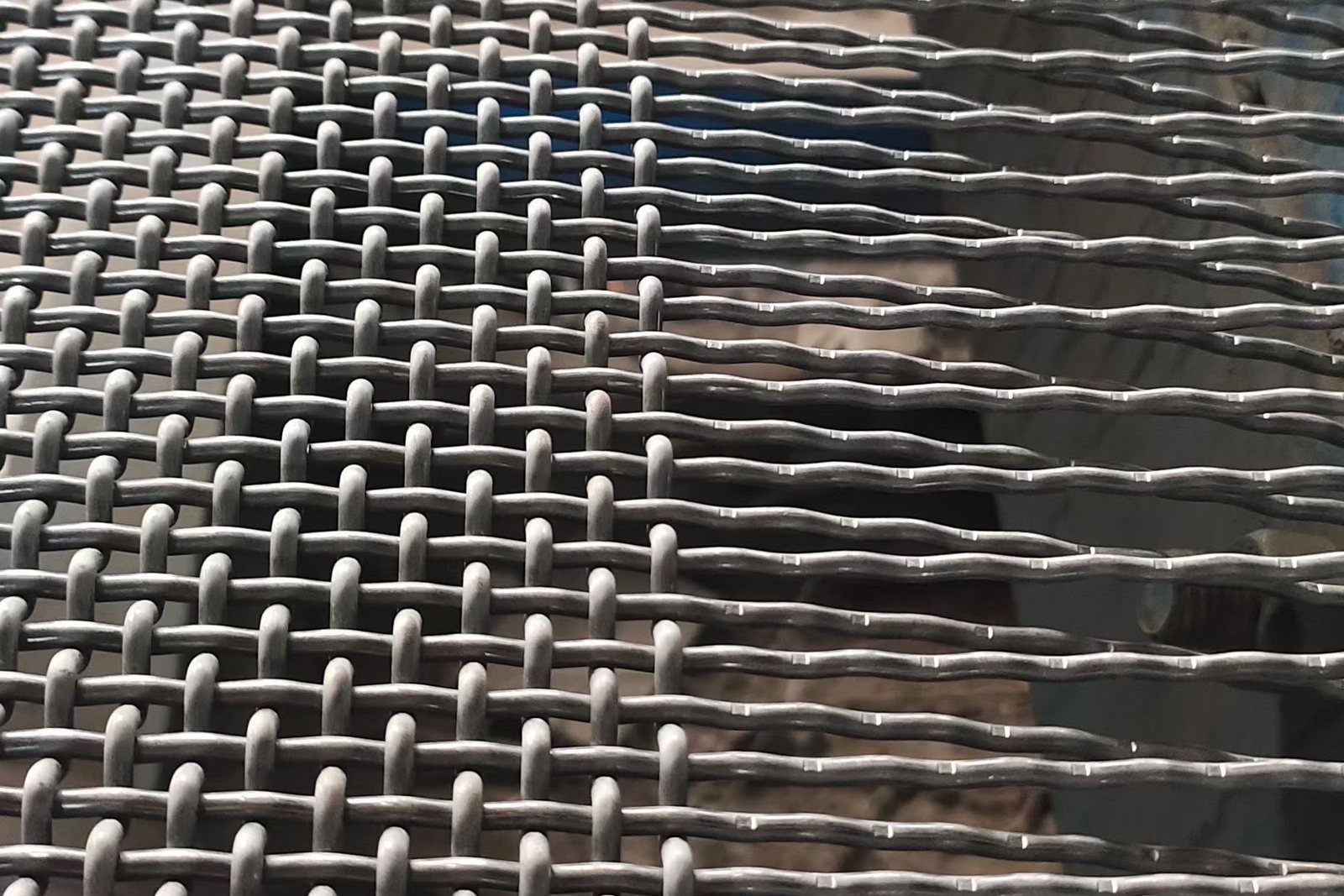 Close-up of woven wire screen structure